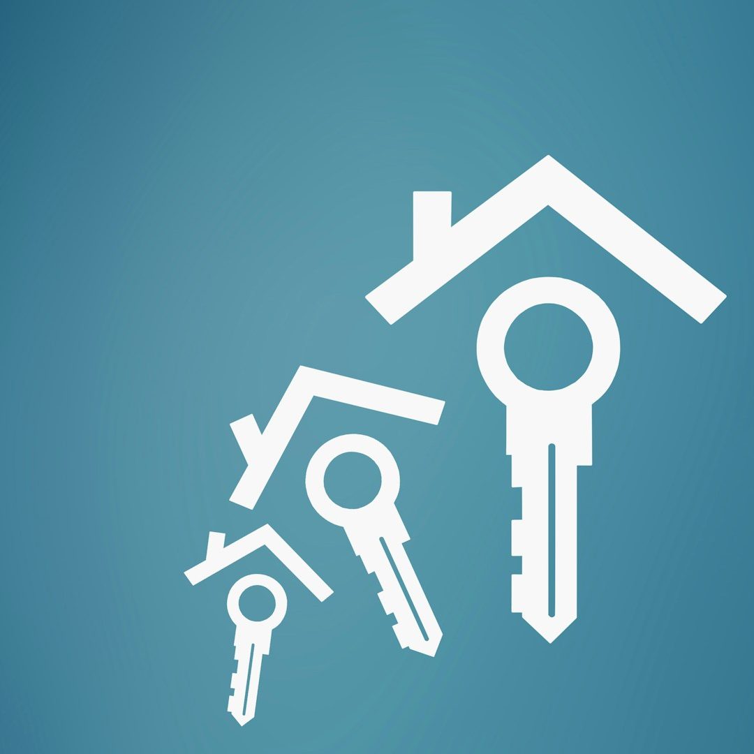 A hand wearing a an Apple-like watch points at a laptop screen